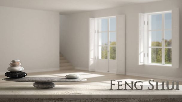 Wooden vintage table shelf with stone balance and 3d letters making the word feng shui over modern empty room with two panoramic windows and staircase, zen concept interior design - Photo, Image