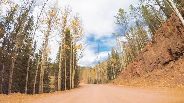 Driving on small mountain dirt roads from Colorado Springs to Cripple Creek in Autumn. - Fotografie, Obrázek