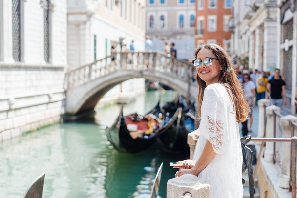Young girl posing on camera in venetian streets - Photo, image