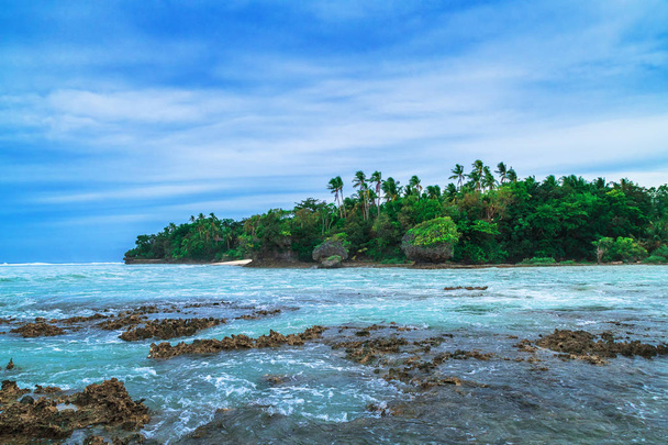 Tropical island. Landscape hill, clouds and mountains rocks with rainforest. Tropical island, sea bay and lagoon, Siargao. Azure water of lagoon. Shore Landscape Bay. Travel concept. - Photo, Image