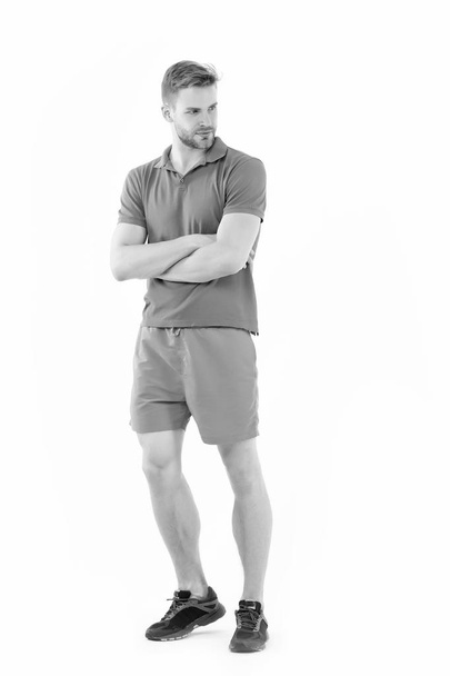 Sportsman isolated on white. Man in active wear and sneakers full length. Personal trainer for healthy lifestyle. Fit and confident. Sport fashion style. Training and workout activity - Fotó, kép