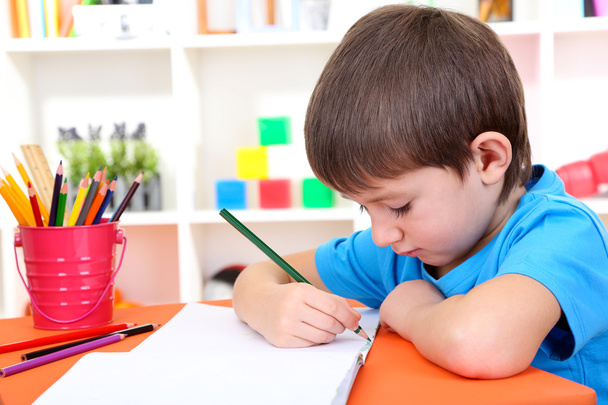 Cute little boy drawing in his album - Foto, Imagem
