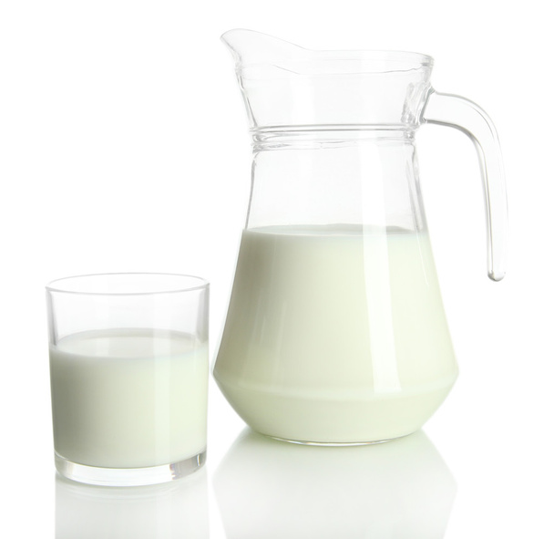 Tasty milk in jug and glass of milk isolated on white - Foto, immagini