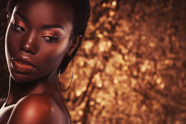 Beauty concept: Portrait of a sensual young African woman with colored make up - 写真・画像