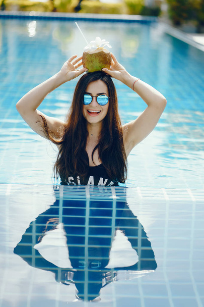 brunette girl eating fruit - Фото, изображение