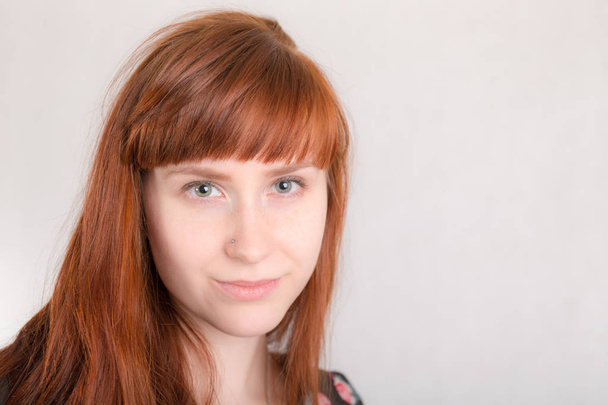 portrait of a girl with long red hair closeup - Photo, image