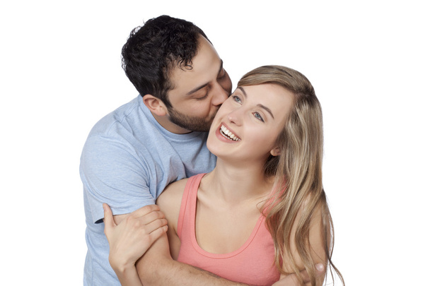 чоловік цілує щоку своєї дружини
 - Фото, зображення