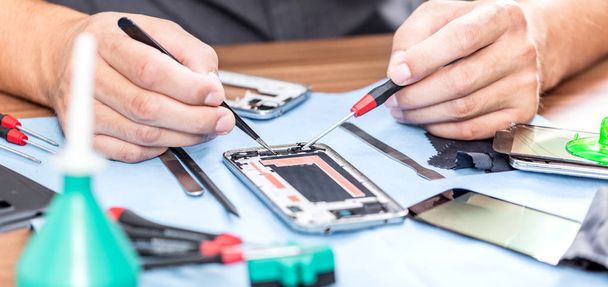 Close-up photos showing process of mobile phone repair - Фото, зображення