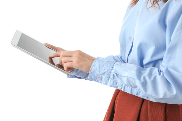 Young woman using tablet PC on white background - Fotoğraf, Görsel