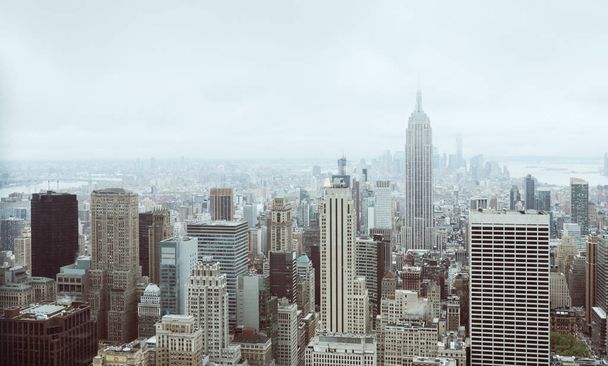 NEW YORK, USA - May 03, 2016: New York skyline in vintage film color. Aerial view over Manhattan with Empire State Building. Manhattan is the most densely populated of the five boroughs of NYC - Zdjęcie, obraz