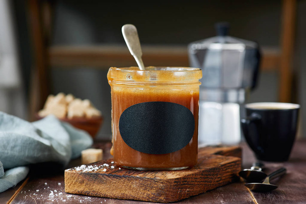 Salted caramel sauce in jar - Photo, Image
