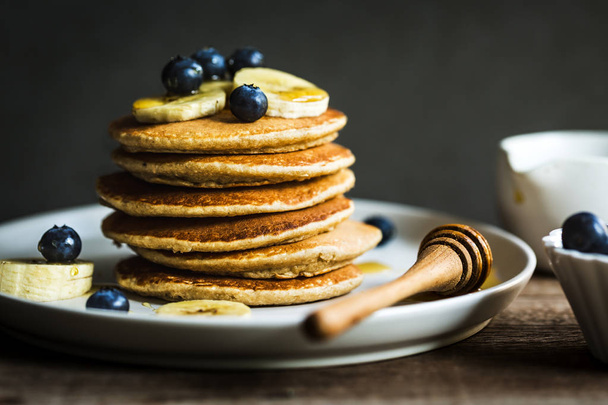 Piles of Banana,Oat Pancakes with fresh Blueberry and Banana - Photo, Image