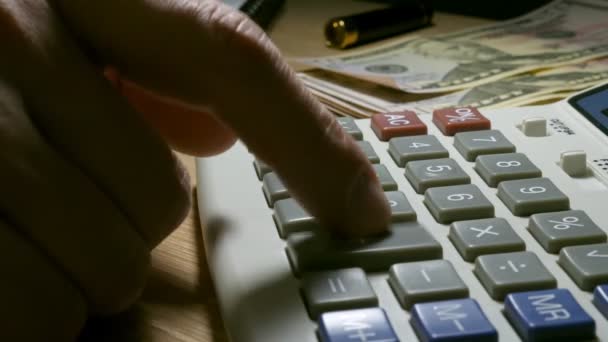 Man making financial calculations using calculator. Close up. - Záběry, video