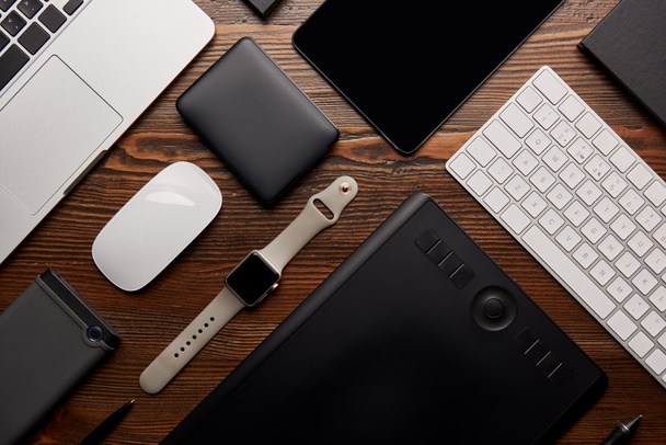 flat lay with different devices on wooden workplace - Photo, Image