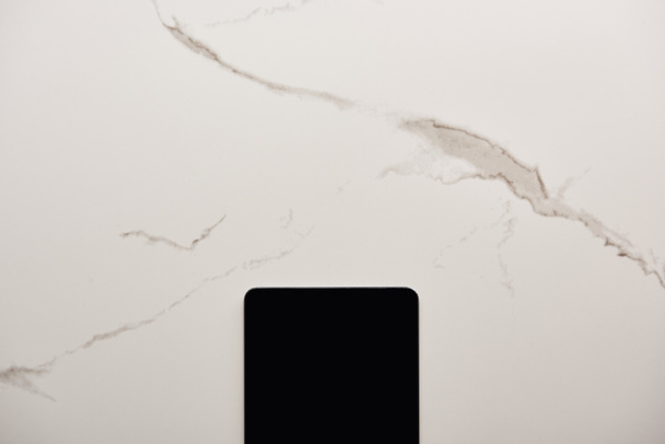 top view of digital tablet on white marble surface - Fotó, kép