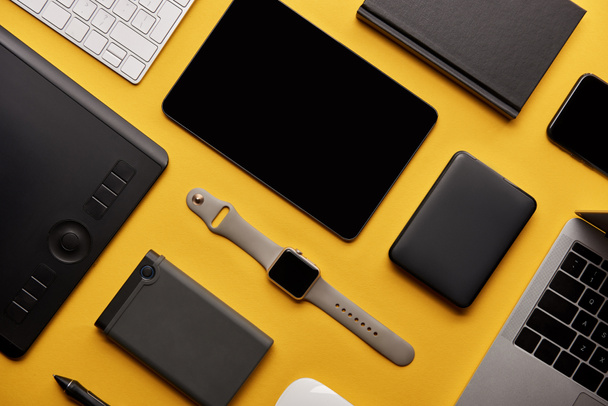 flat lay with different wireless devices on yellow surface - Photo, Image