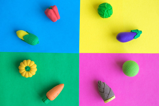 Different rubber vegetables on colorful background minimal creative concept. - Photo, image