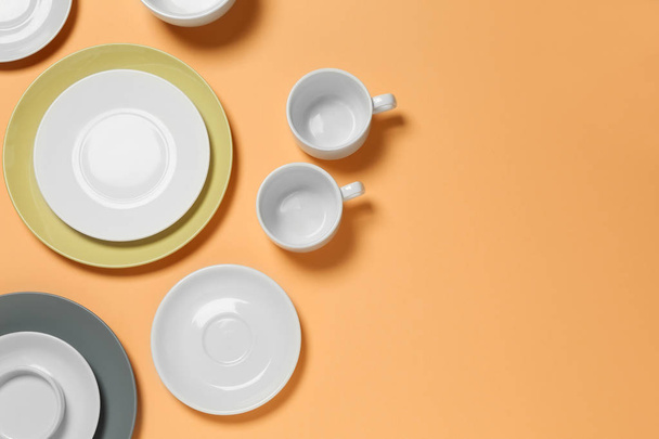 Set of clean tableware on color  background - Foto, Imagem
