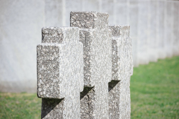close up view of old memorial headstones placed in row at cemetery  - Photo, Image