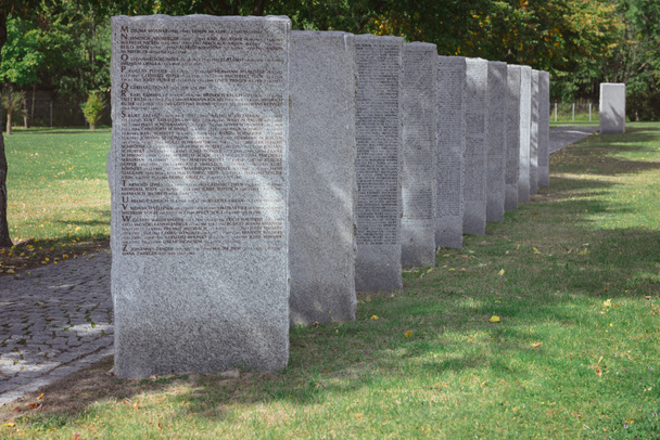 old memorial gravestones with lettering at cemetery - Photo, Image