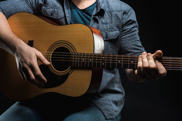 male hands play acoustic guitar - Фото, изображение