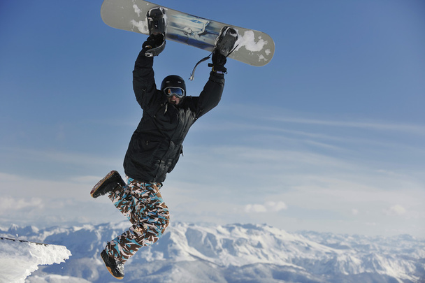 Freestyle snowboarder jump and ride - Photo, Image