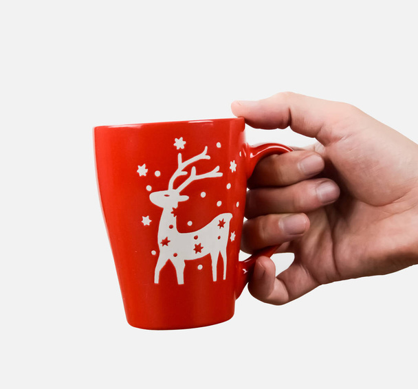 Hand with a Christmas cup - 写真・画像