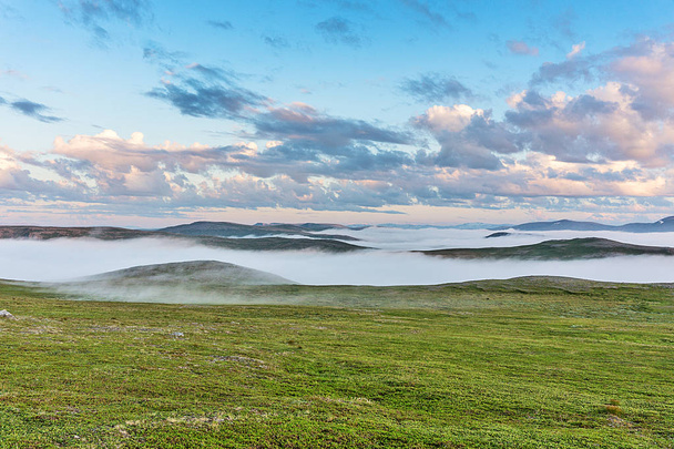 Fog on the hills at sunset, Soroya island, Norway - Valokuva, kuva