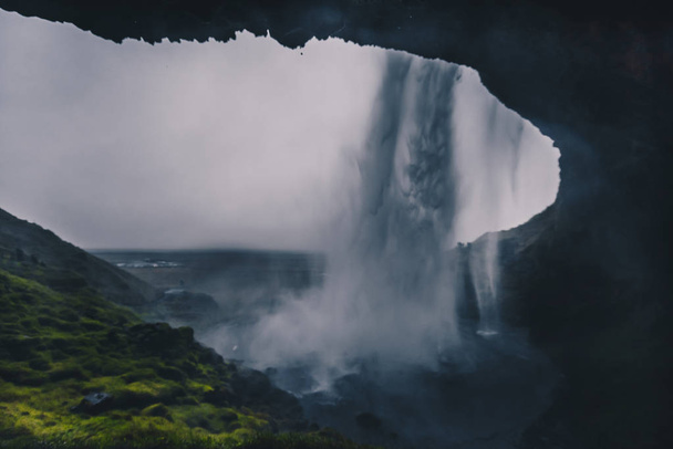 Majestic waterfall Seljalandsfoss in Iceland in autumn in cloudy weather - Photo, image