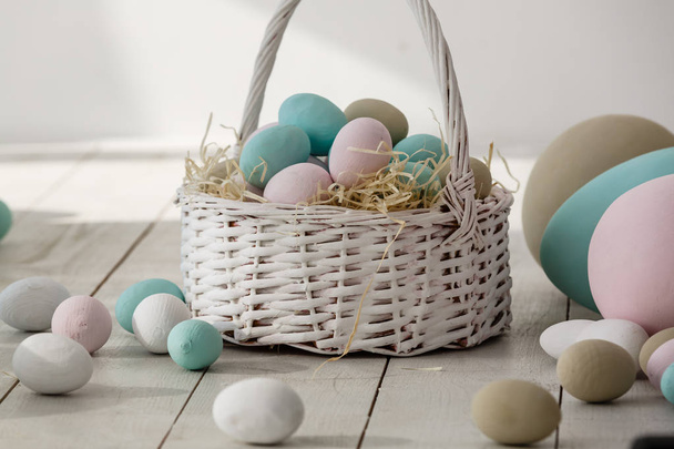 Pile of colorful pastel easter eggs in decorated living room - Photo, image
