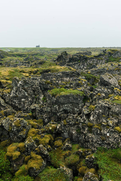 Lava fields in front of the Black Church in Iceland - Foto, immagini