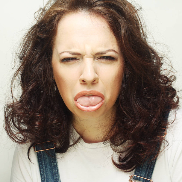 Woman making a funny face - Foto, Bild