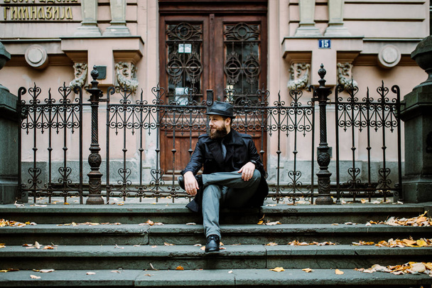 Handsome bearded man with mustache on the street. Movember concept - Фото, зображення
