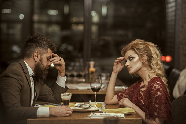 couple with misunderstanding at restaurant. misunderstanding of couple with bearded man and blonde beautiful woman in cafe - Fotó, kép