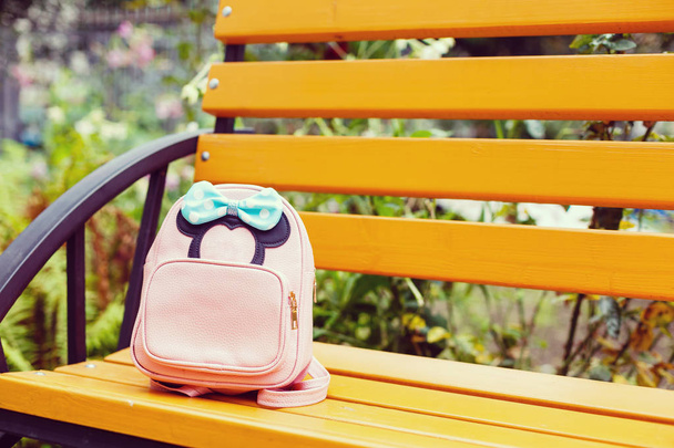 Leather backpack on bench outdoors - Photo, Image
