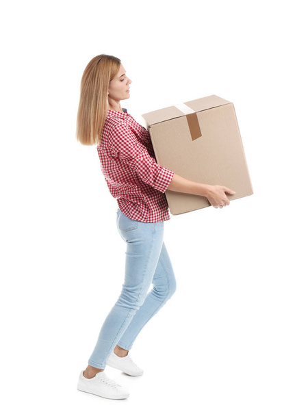 Full length portrait of woman carrying carton box on white background. Posture concept - Valokuva, kuva