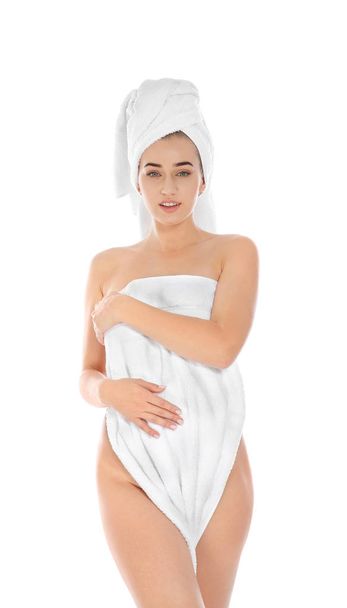 Portrait of young pretty woman with towels on white background - Foto, Imagem