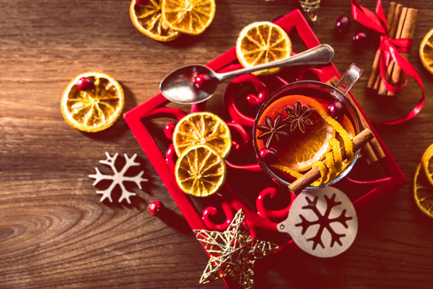Two glasses of hot mulled wine with christmas decoration - Foto, imagen