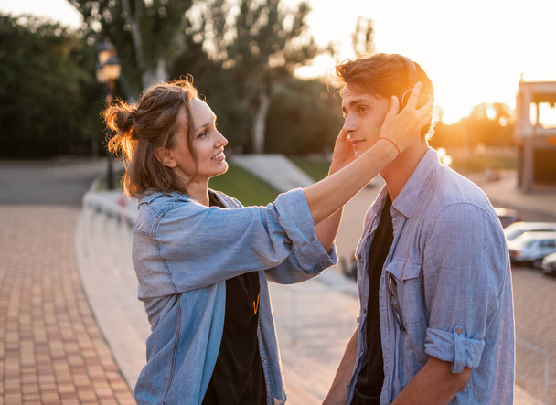 Lovely young hipster couple dating during summer sunset. - Photo, Image
