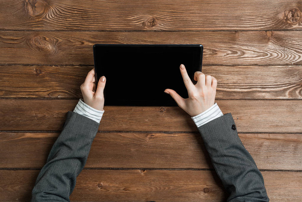 Close up of female hands touching screen with finger on tablet pc computer - Fotó, kép