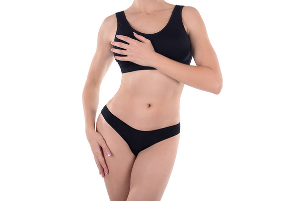 Base black lingerie on cropped female body, isolated on white. - Photo, Image