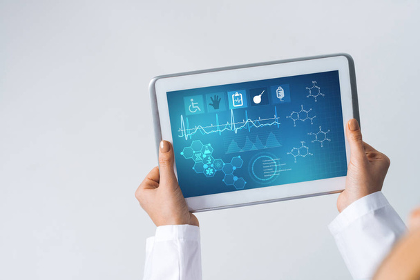 Tablet pc device with medicine interface screen in hands of doctor - 写真・画像