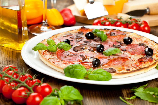 Tasty pizza on wooden table, top view - Fotografie, Obrázek