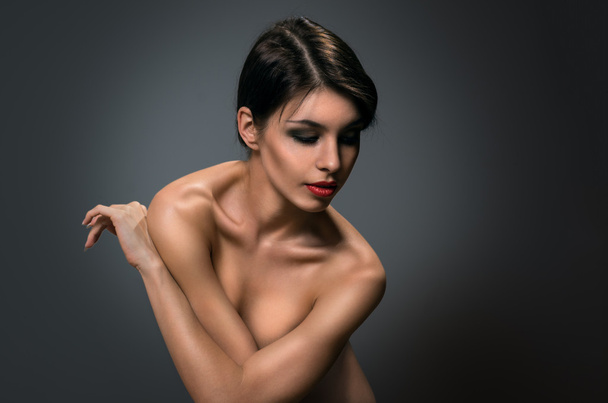 Beautiful naked brunette. Portrait. - Photo, Image
