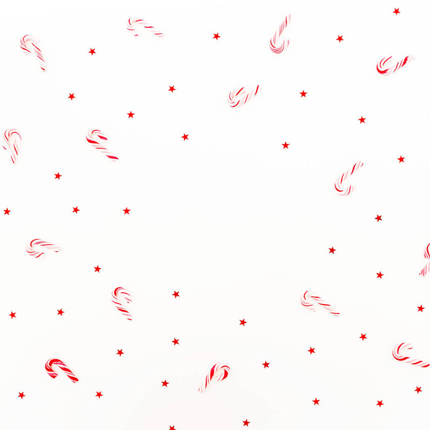 Padrão de moldura de Natal de cana-de-açúcar e confete vermelho brilhante no fundo branco. Deitado plano, vista superior
. - Foto, Imagem