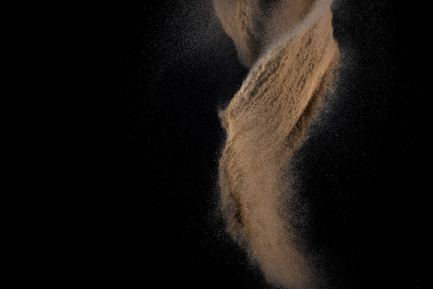 Sandy explosion isolated on black background. Abstract particles cloud. Texture element for design. - Φωτογραφία, εικόνα
