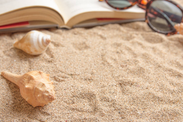 Open book on sandy beach with copy space. - Foto, Imagem