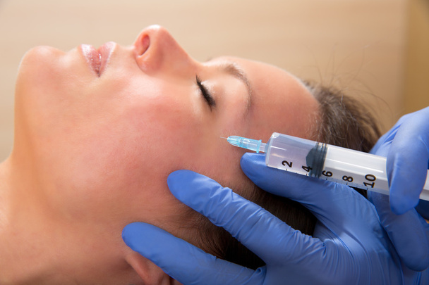 Anti aging facial mesotherapy syringe on woman face - Фото, зображення