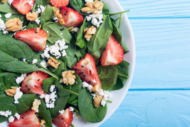 Strawberry salad with spinach , cheese and walnut - 写真・画像