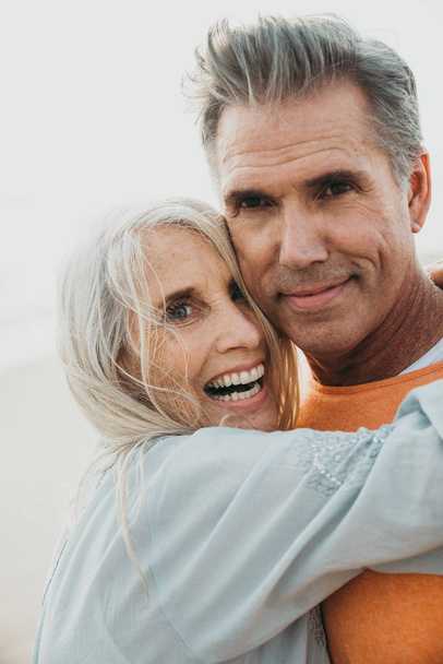 Happy senior couple spending time at the beach. Concepts about love,seniority and people - Foto, afbeelding